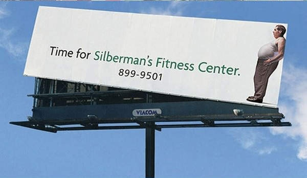 Funny Billboard with overweight man acting as a optimal illusion